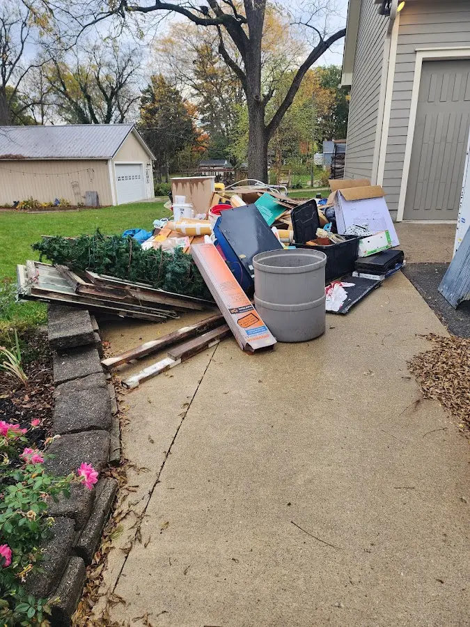 Dumpster being loaded with debris for 30 Yard Dumpster Rental in Antrim
